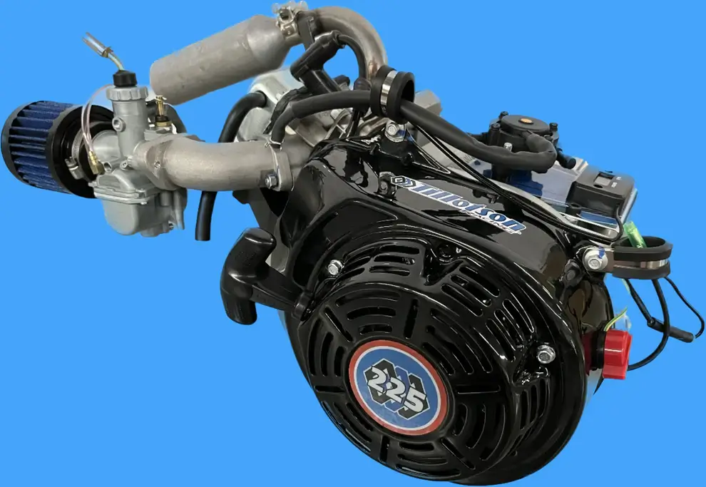 Black Tillotson T4 225RS 225cc 2 Valve 4-Stroke Karting Engine with a Mounted Exhaust and an Air Filter.